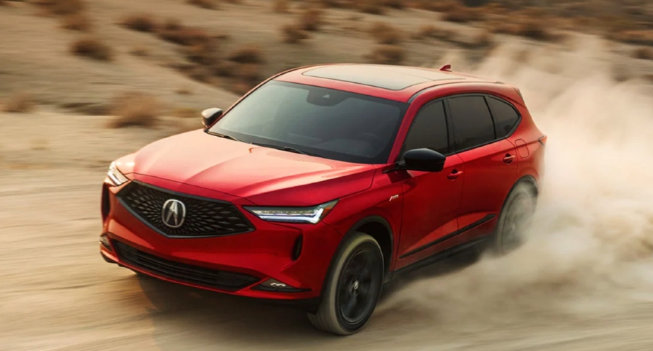 Acura MDX 2023 Red Luxury Midsize SUV to drive off-road. 