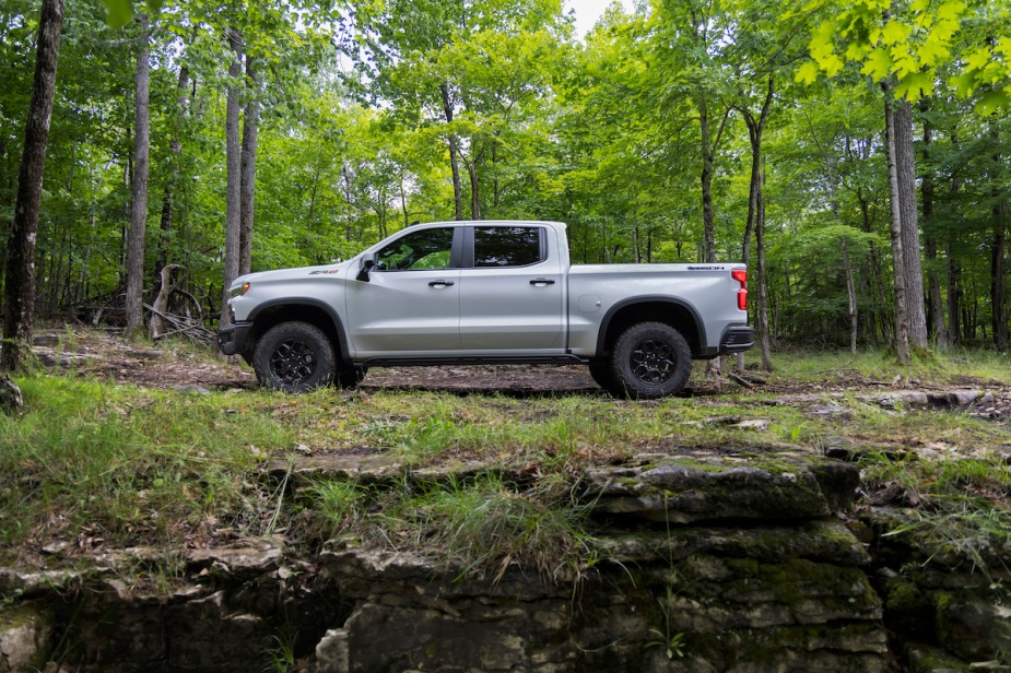 The 2023 Chevrolet Silverado 1500 Pickup Truck is located in a wooded area.