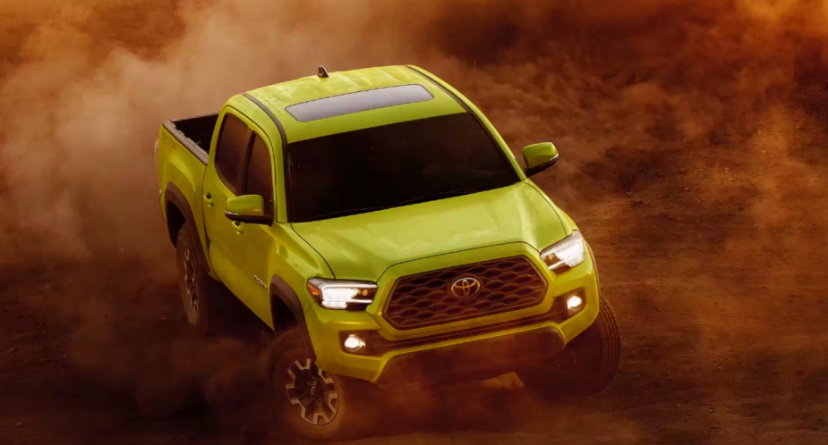 Green Toyota Tacoma mid-size off-road pickup truck. 