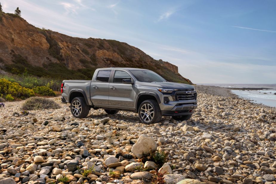 2023 Chevrolet Colorado Z71 midsize pickup truck parked on the beachfront covered in rocks