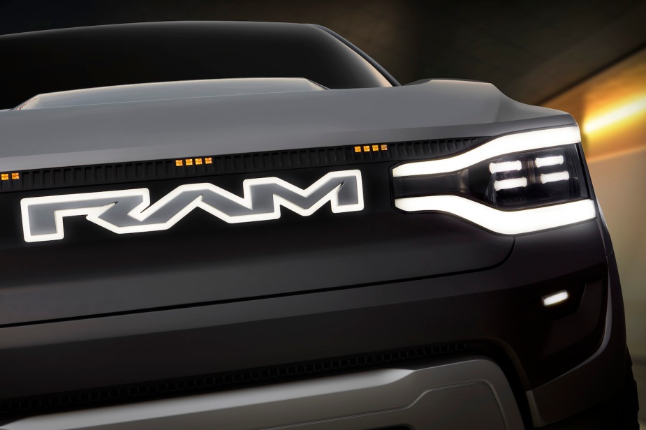 Close up of RAM letters on the front grille of a Revolution pickup truck.
