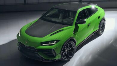 A green 2023 Lamborghini Urus Performante luxury SUV is parked.