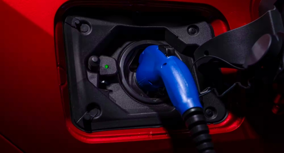 A red Toyota RAV4 Prime plug-in hybrid SUV is in charge.