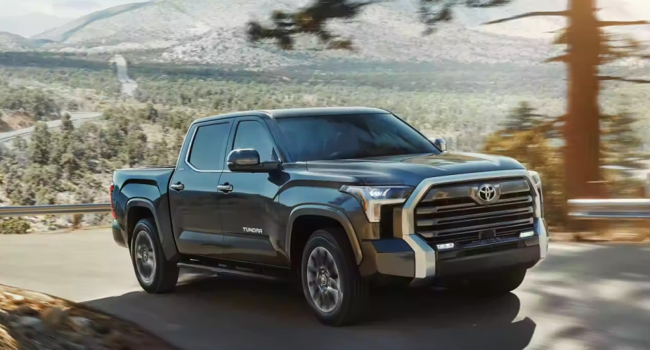 A full-size 2023 Toyota Tundra black pickup truck is on the road.