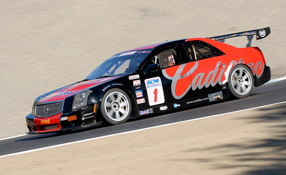 The Cadillac team, the black race car with the inscription CTS-V, races along the track at high speeds.