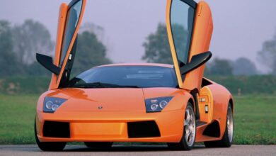 This orange Lamborghini Murcielago supercar would lose a race to 60 MPH to a Rivian electric pickup truck