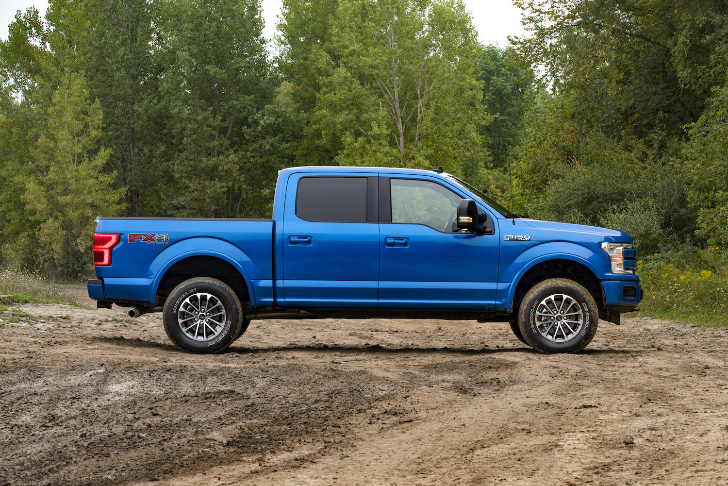 The blue Ford F-150 PowerBoost Hybrid pickup truck, the cheapest full-size hybrid option