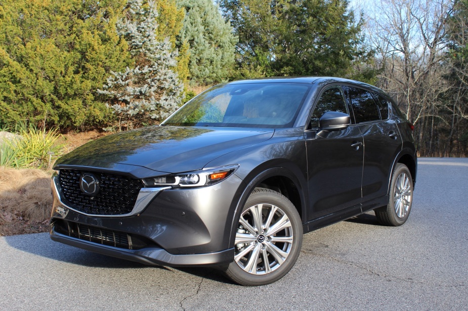A small gray 2023 Mazda CX-5 SUV is parked outside. 