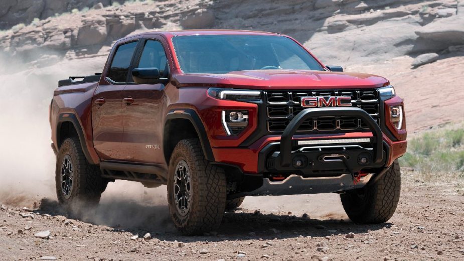 A front angle view of the 2023 GMC Canyon red pickup truck is better than the 2022 model with its redesigned design.