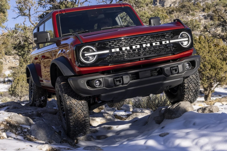 2022 Ford Bronco Wildtrak driving off-road, automaker will pay reservation holders to buy something else.
