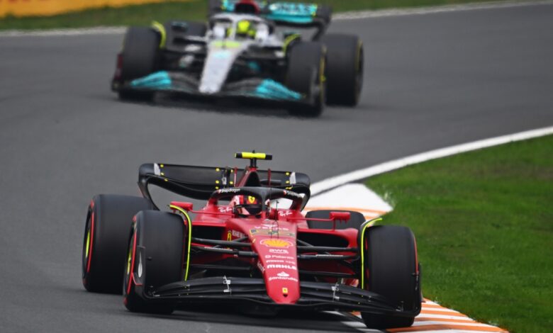 A mercedes and ferrari race car competing during a Formula 1 race, may soon be joined by a Ford.
