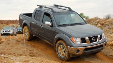 A Nissan Frontier drives on a trail, it has some complaints on RepairPal.
