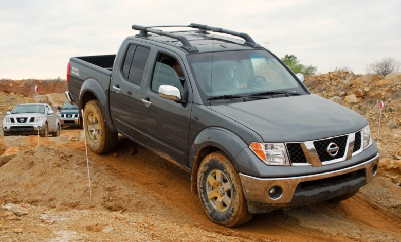 A Nissan Frontier drives on a trail, it has some complaints on RepairPal.