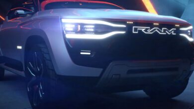 A gray Ram Revolution full-size electric pickup truck concept is parked.
