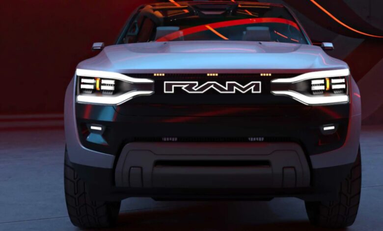 A gray Ram Revolution electric pickup truck concept is parked.