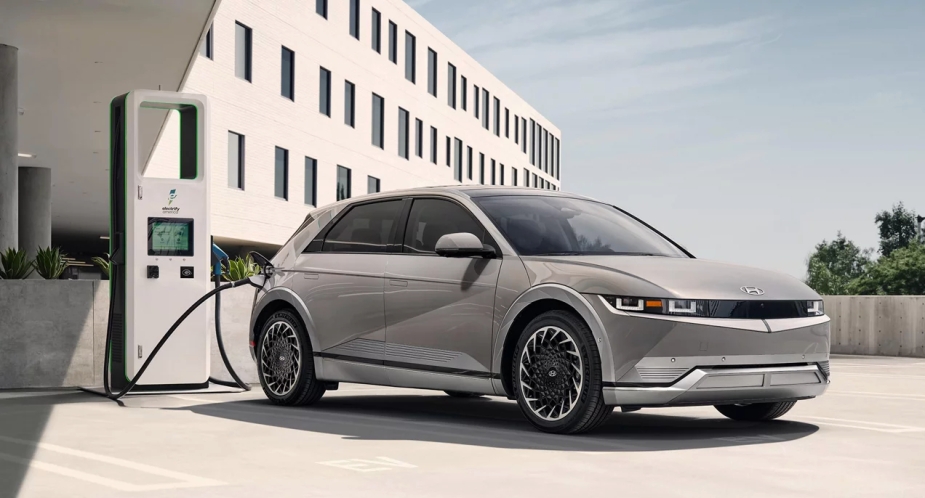A small gray 2023 Hyundai Ioniq 5 electric SUV is parked and charging. 