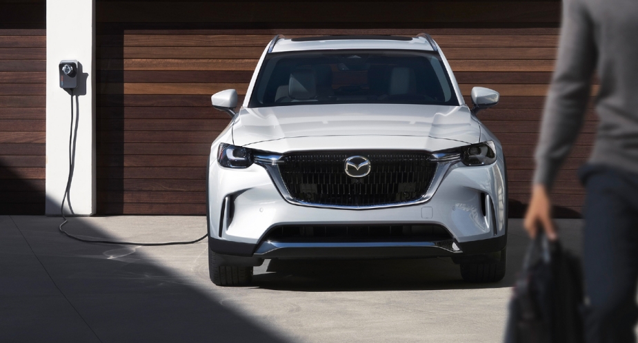 A white 2024 Mazda CX-90 PHEV midsize SUV is in charge. 