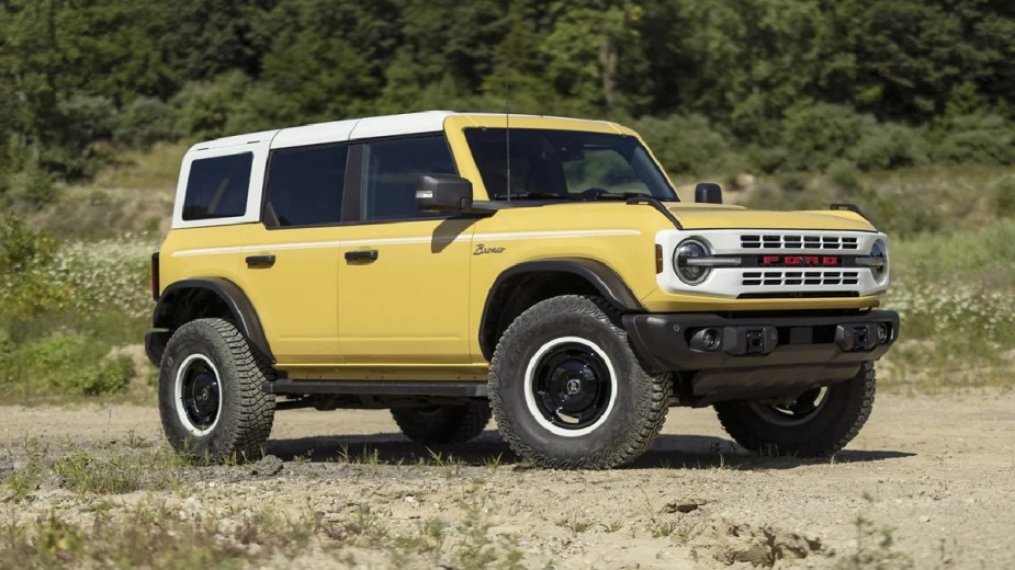 Front view of yellow 2023 Ford Bronco, second best new midsize SUV of 2023, according to Car and Driver