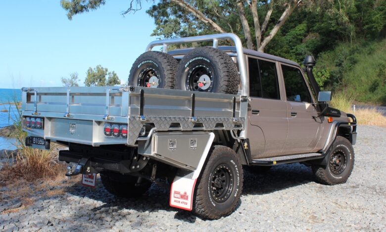 This is a Toyota Land Cruiser truck with an aluminum aftermarket Australian-style utility or ute bed made by NorWeld.