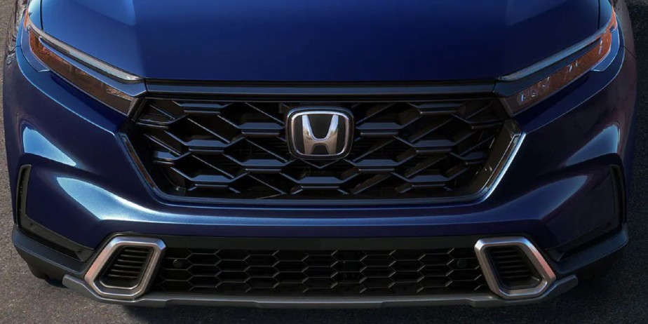 The front of a small blue 2023 Honda CR-V SUV. 