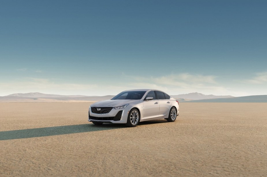 The speedy Cadillac CT5-V sedan rightfully shows off its white paint and luxury sedan profile in the desert. 