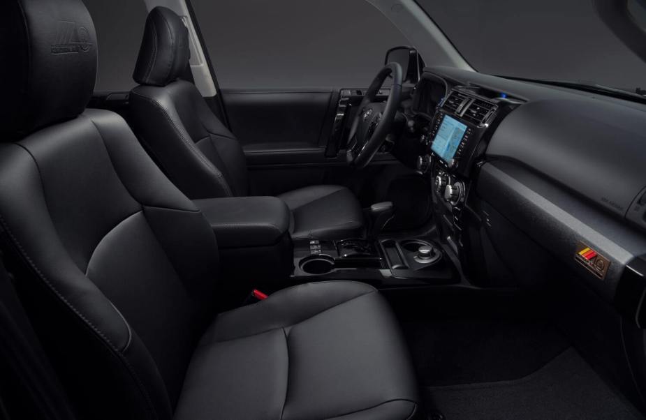 The black interior of a Toyota 4Runner 40th Anniversary Edition 2023 with 3rd row and 4WD available.