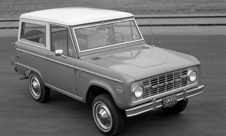 A 1970 Ford Bronco with a white roof