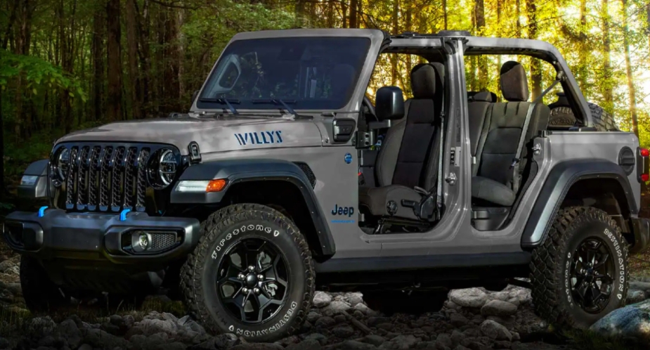 A small gray 2023 Jeep Wrangler 4xe electric SUV is parked.