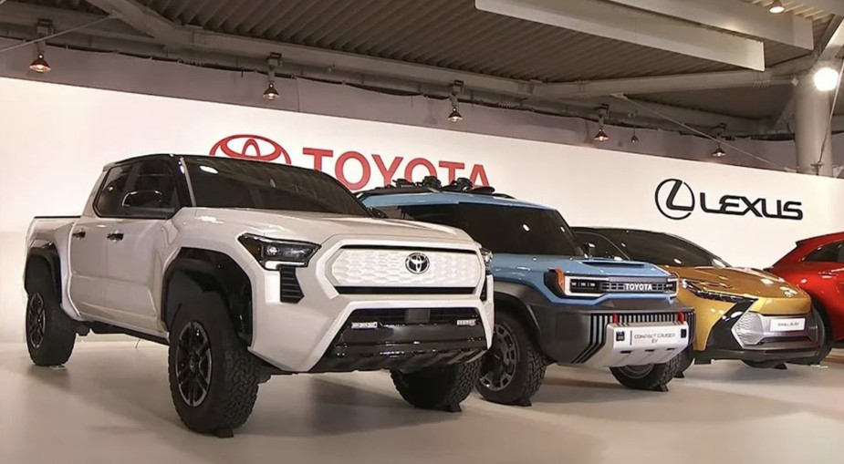 The Toyota Tacoma EV concept is on stage near the other options