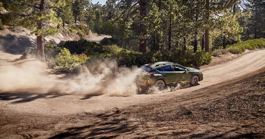 A 2024 Subaru Crosstrek drives down a dusty trail like a small SUV.
