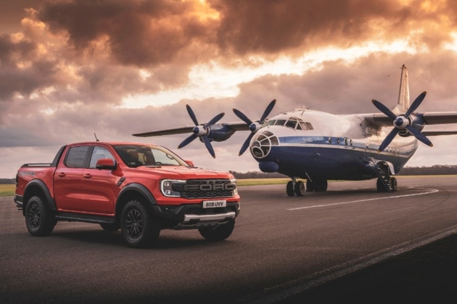 The 2024 Ford Ranger Raptor is in front of a plane, and it may soon arrive in the United States.