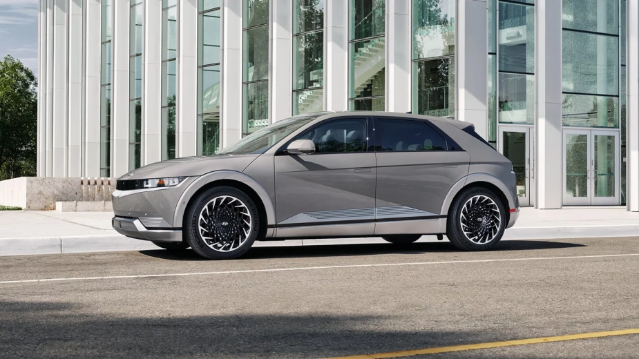 A 2023 Hyundai Ioniq 5 electric SUV stands in an urban environment.