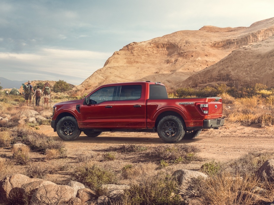 Parked in the desert, a red Ford F-150 is one of the fastest full-size trucks around.
