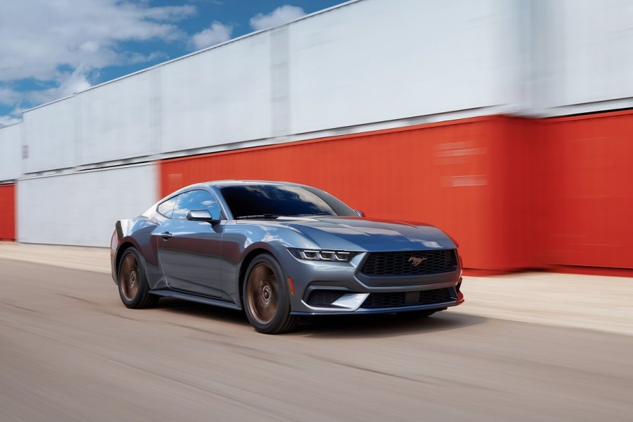 The 2024 Ford Mustang EcoBoost Premium drives through a port. 