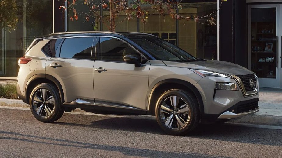 Side view of tan 2023 Nissan Rogue crossover SUV