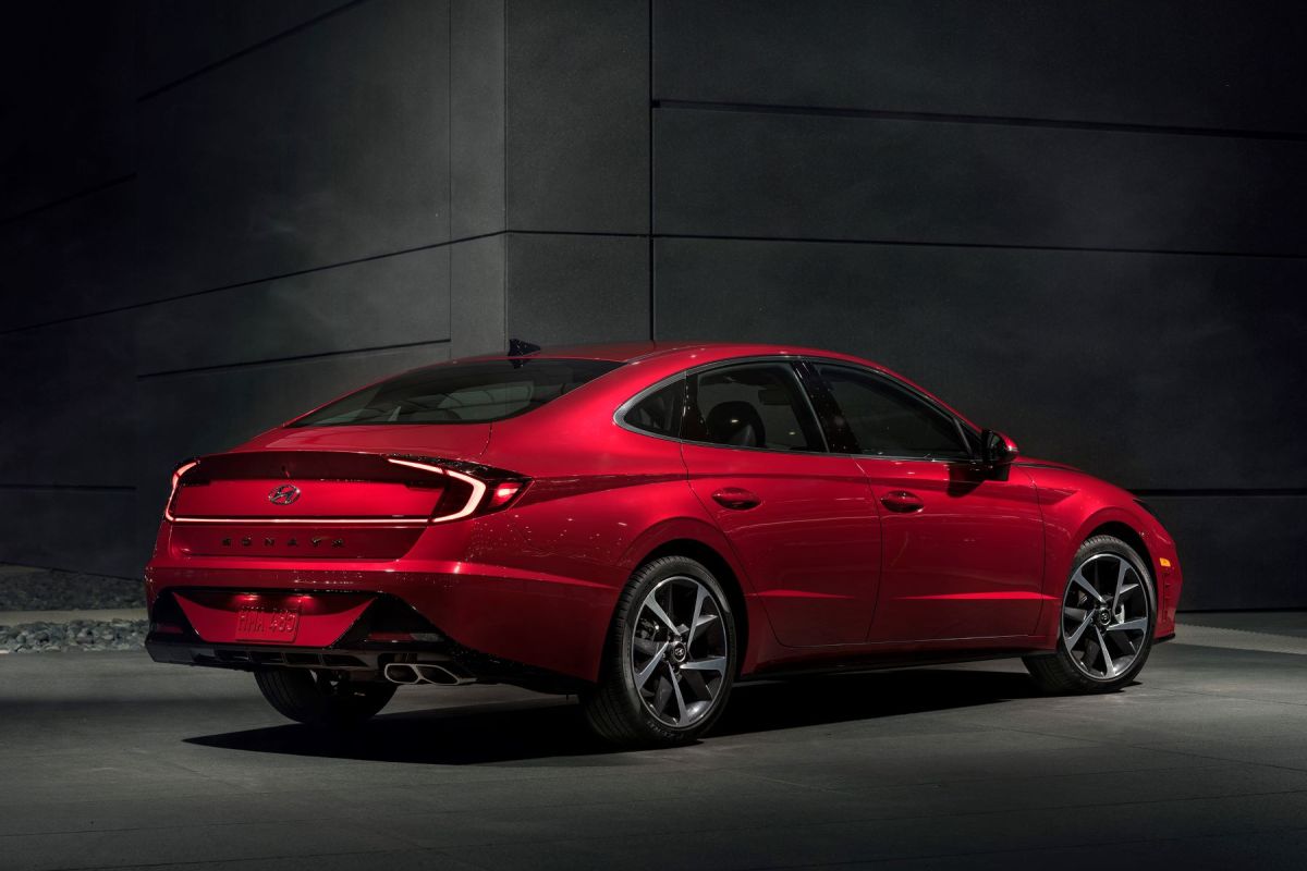 An exterior promotional photo of a red 2023 Hyundai Sonata midsize sedan