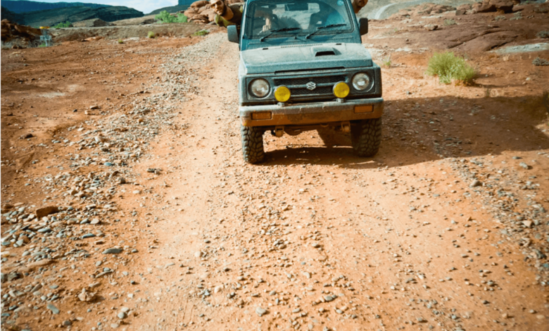 Peter Corn and Neal Thompson driving a second-gen Suzuki Jimny through Moab