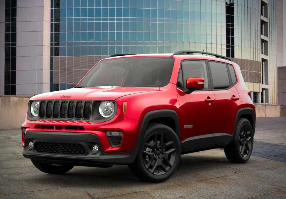 Red 2023 Jeep Renegade in front of a building seen from the front 