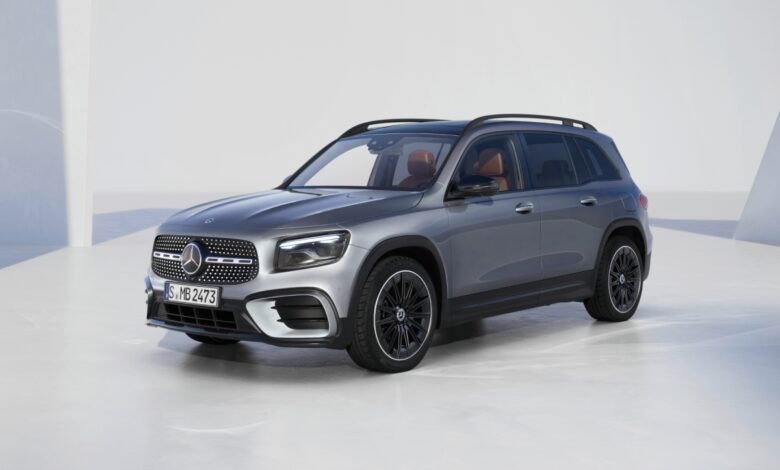 A silver 2024 Mercedes-Benz GLB with a white backdrop.