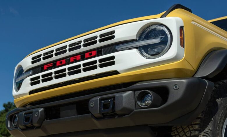 The front grille of a yellow 2023 Ford Bronco Heritage Edition Limited Edition.