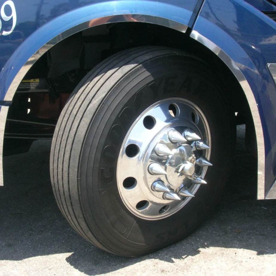Semi-trailer truck front wheel with chrome plated nut cover bolts.