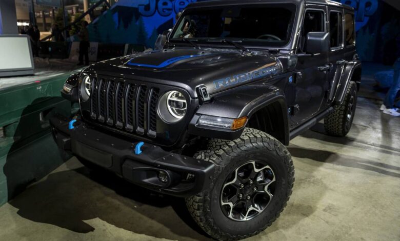 The new Jeep Wrangler with the 4xe engine in dark grey with blue accents.
