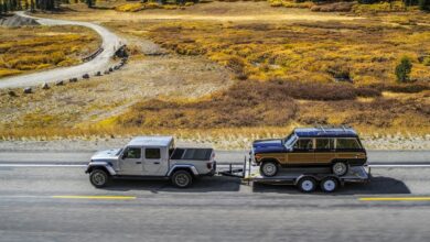 Jeep Gladiator towing a classic Wagoneer SUV.