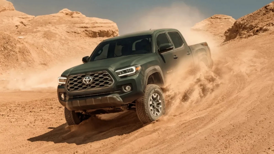 The 2023 Toyota Tacoma drives through the sand.  The 2024 Tacoma will be here soon.